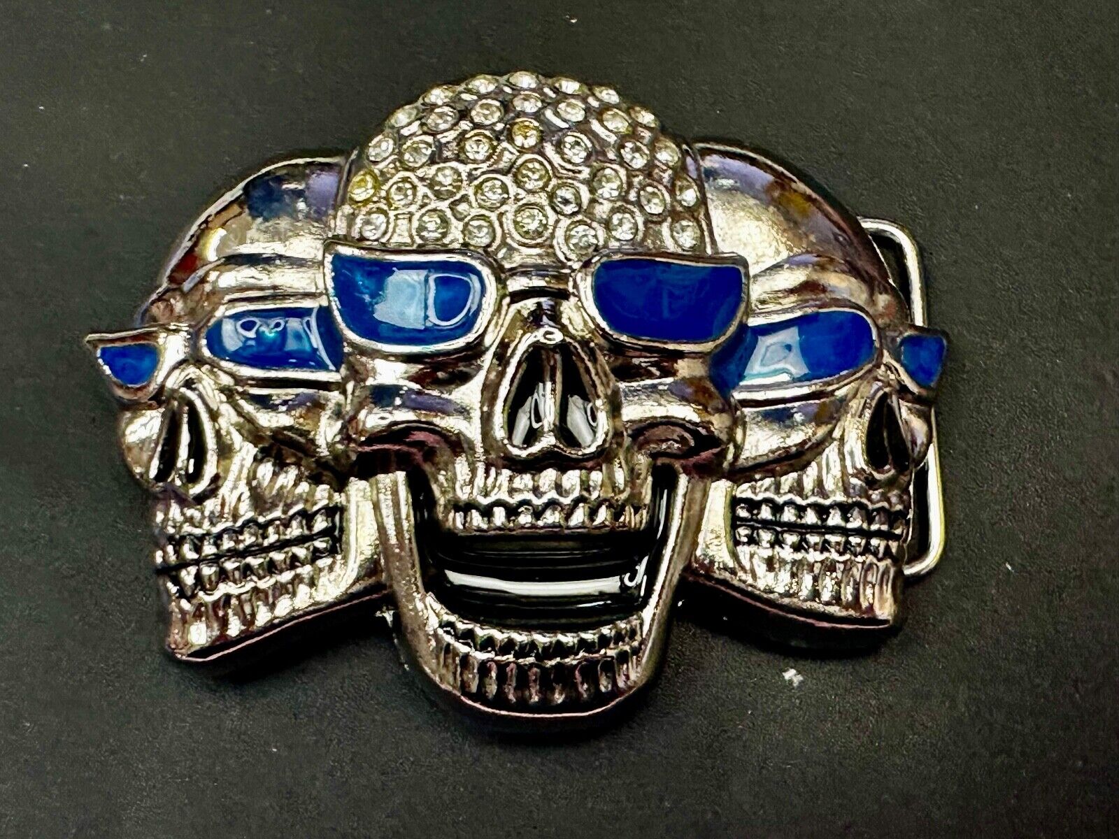 Three Skull's Heads Rhinestone Accented W/ Blue Shades Silver Tone Belt Buckle