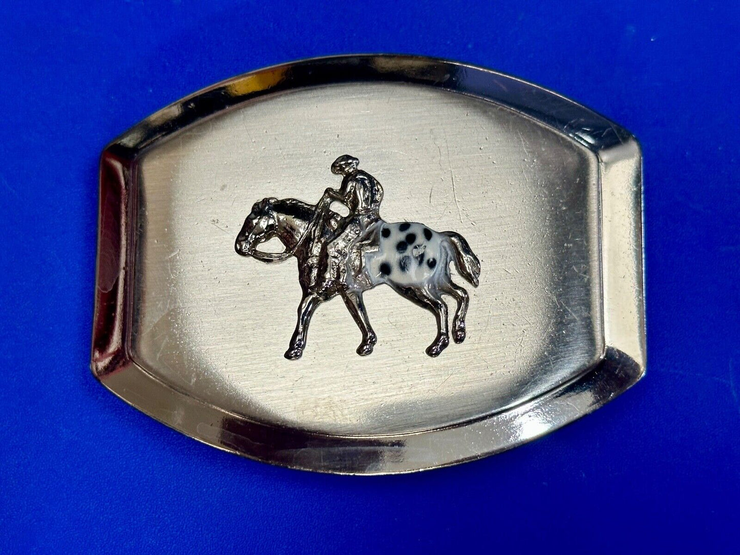 Vintage Horseback Riders cowboys belt buckle with black & white enamel accents
