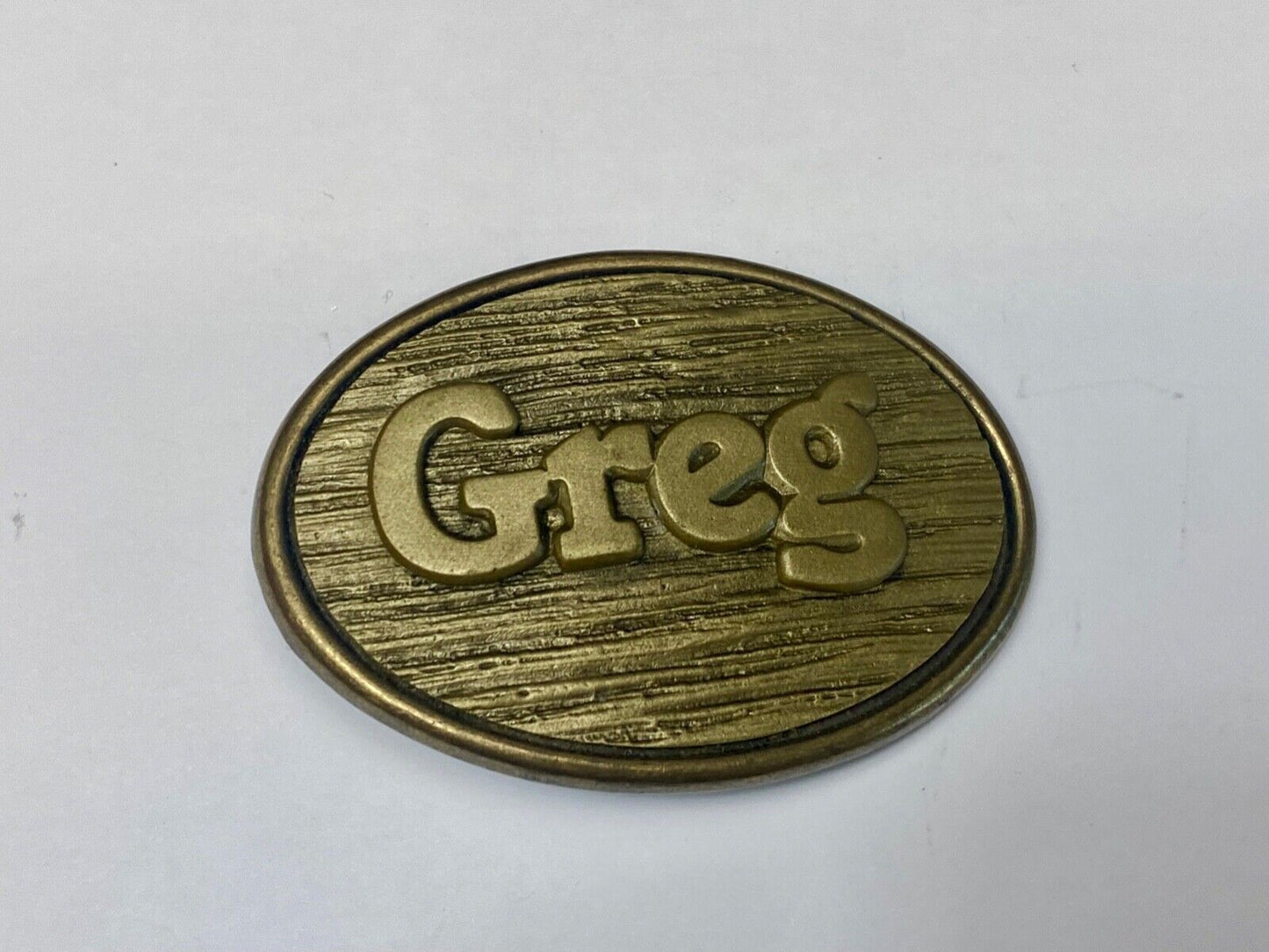 Vintage GREG name metal wood grain western Belt Buckle By Oden - Made In USA
