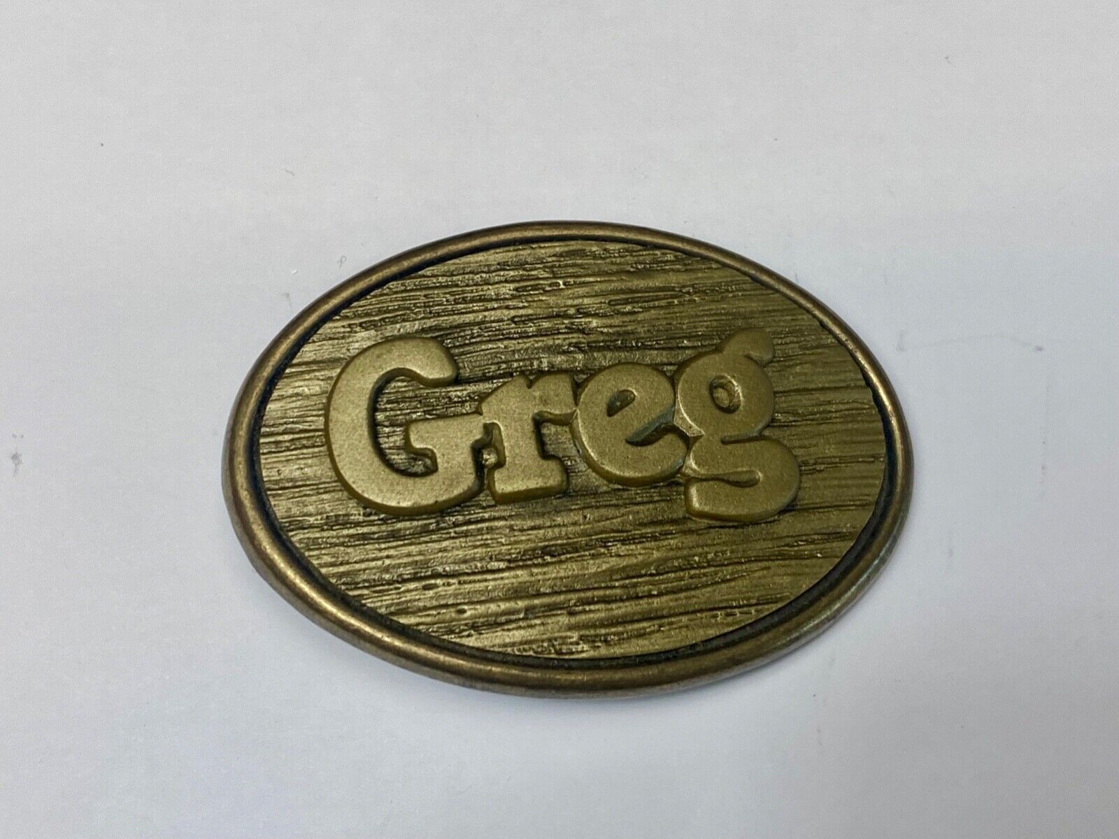 Vintage GREG name metal wood grain western Belt Buckle By Oden - Made In USA