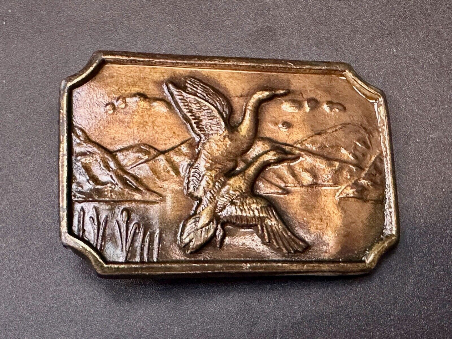 Two ducks flying from pond - Vintage nature scene belt buckle