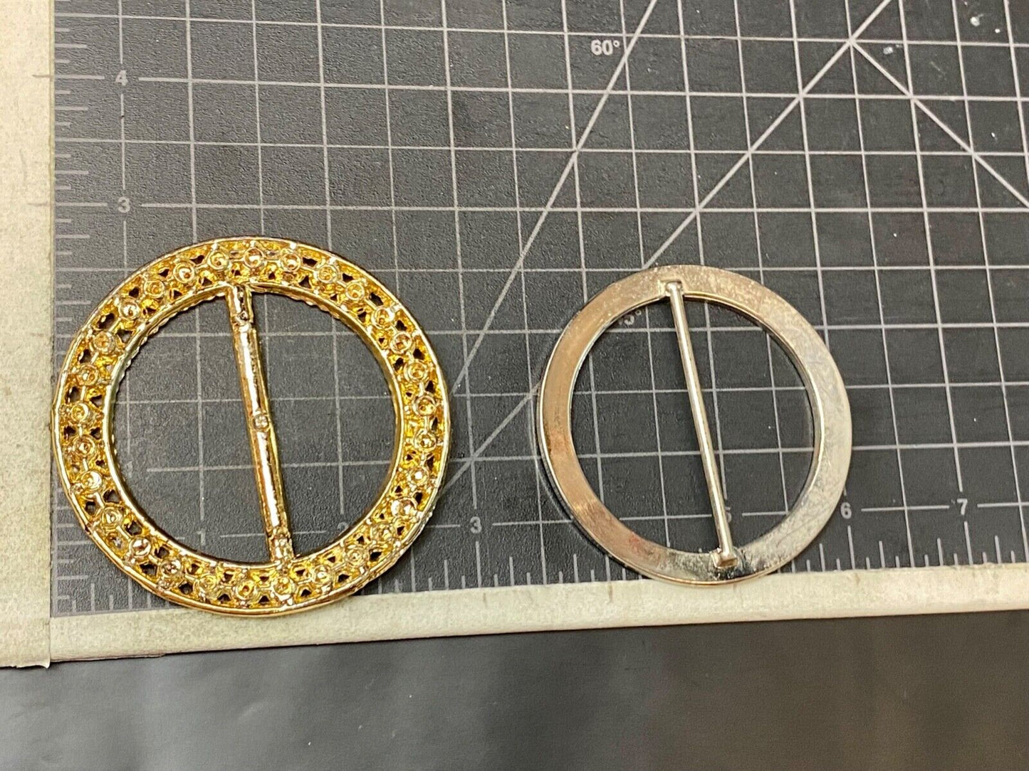 Two piece lot of antique Rhinestone covered round scarf slides