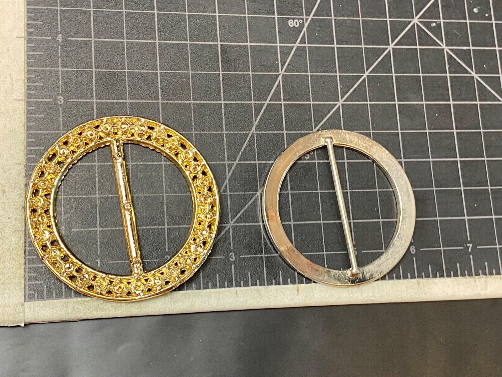 Two piece lot of antique Rhinestone covered round scarf slides