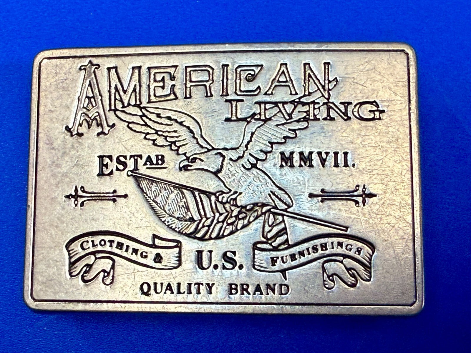 American Living Clothing & Furnishing U.S Quality Brand Promo Belt Buckle