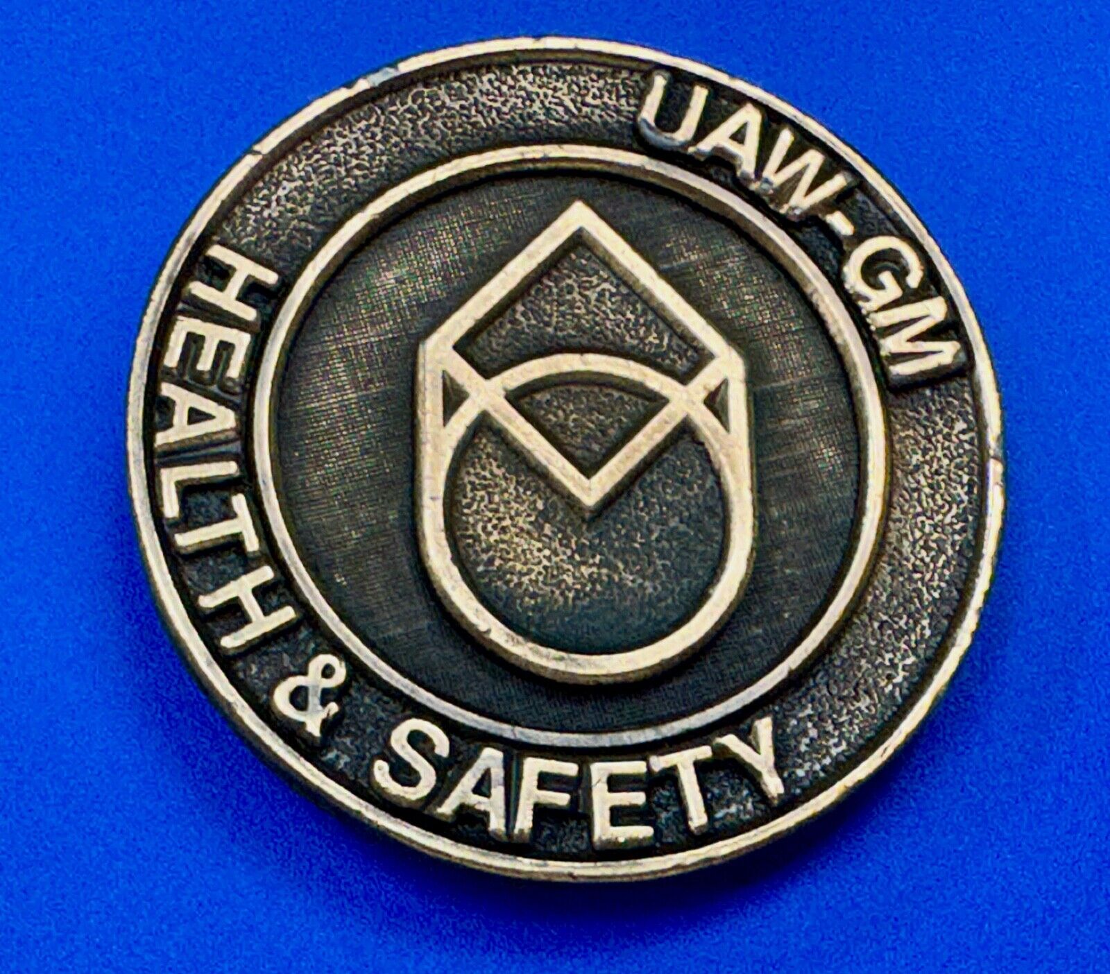UAW-GM auto workers union round Health & Safety Award belt buckle