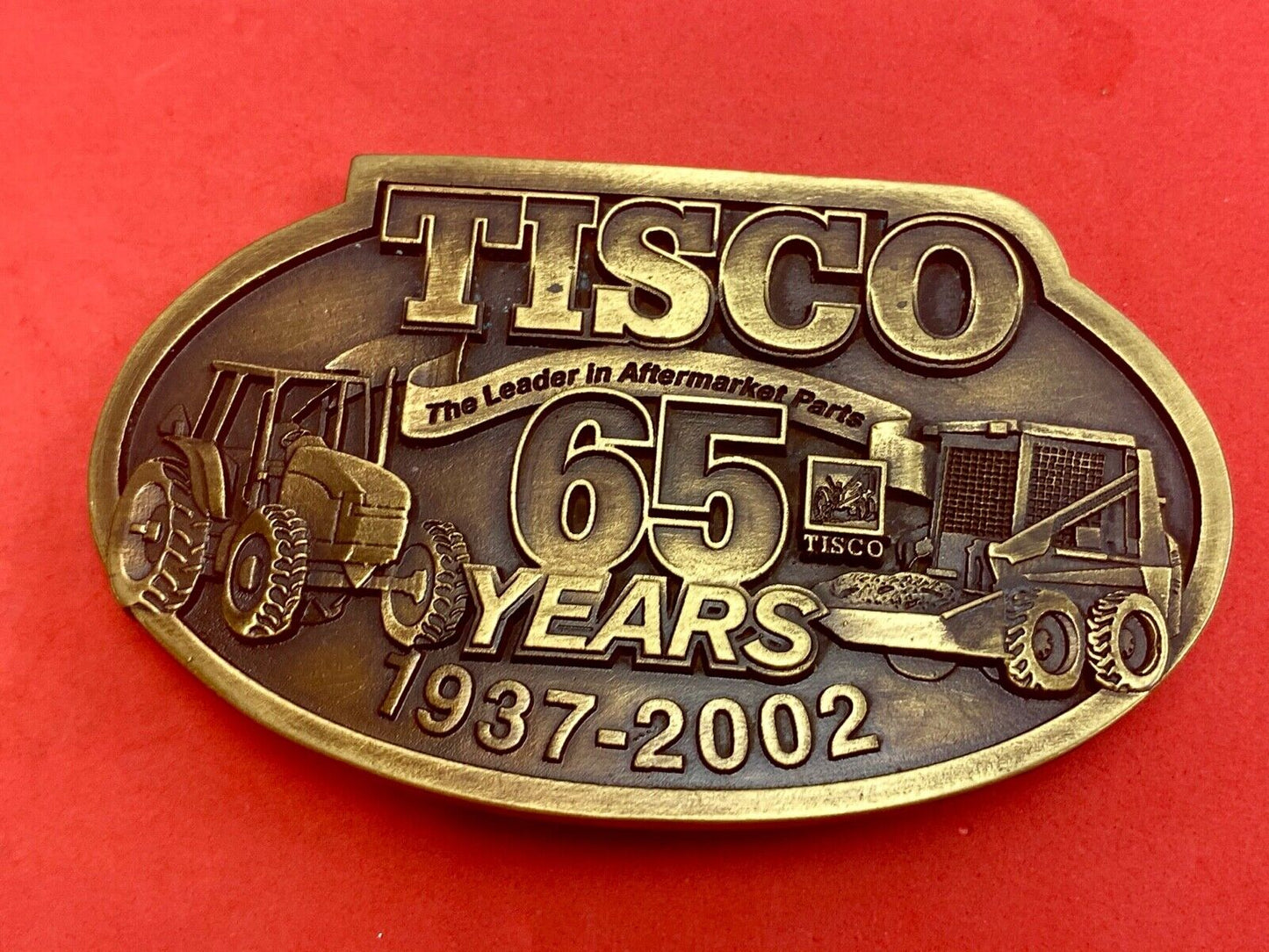 65 years - Tisco Tractor Implement Supply Spec Cast Farming Belt Buckle 