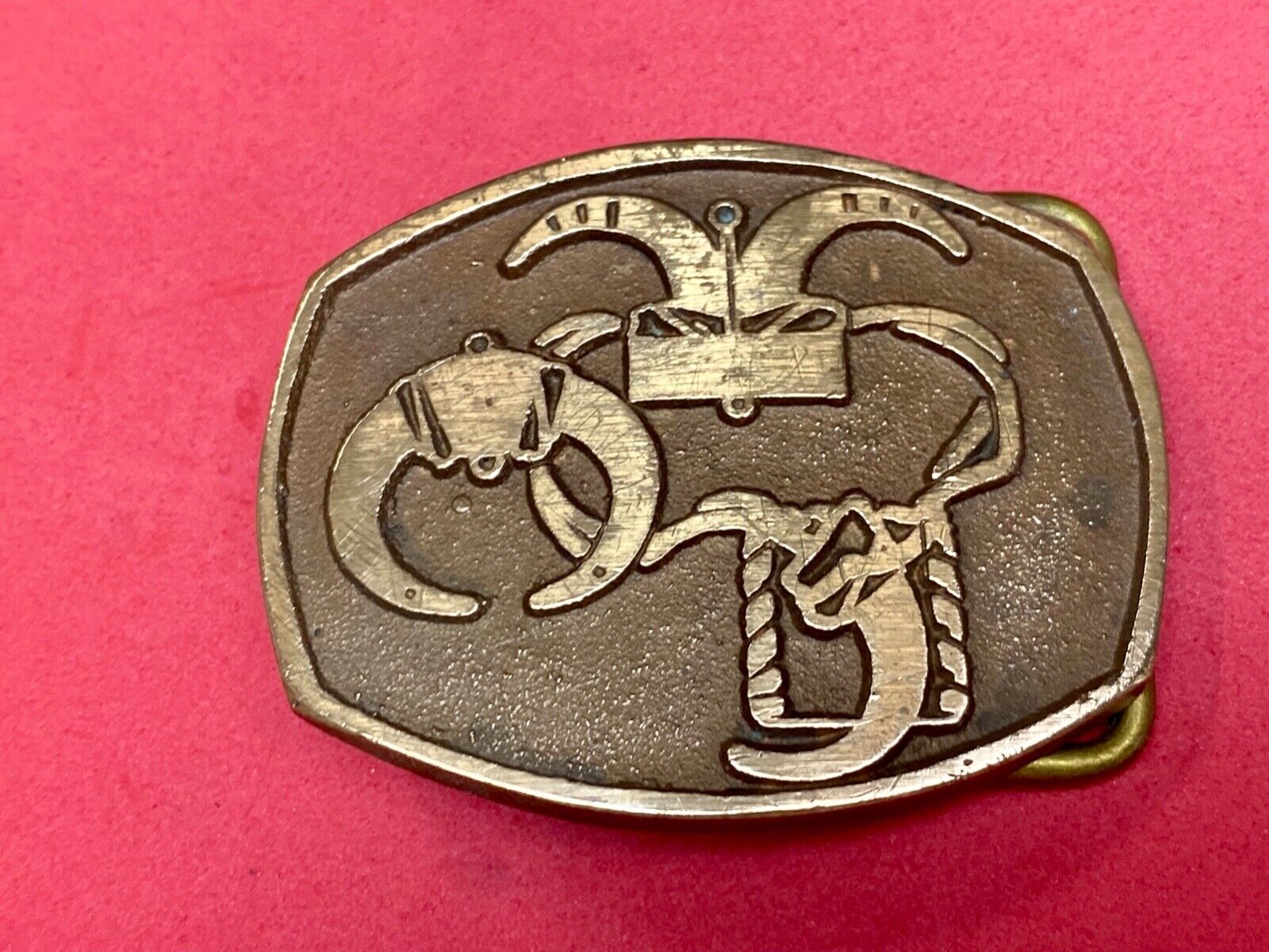 unknown to me - cattle branding symbols? longhorn western? belt buckle