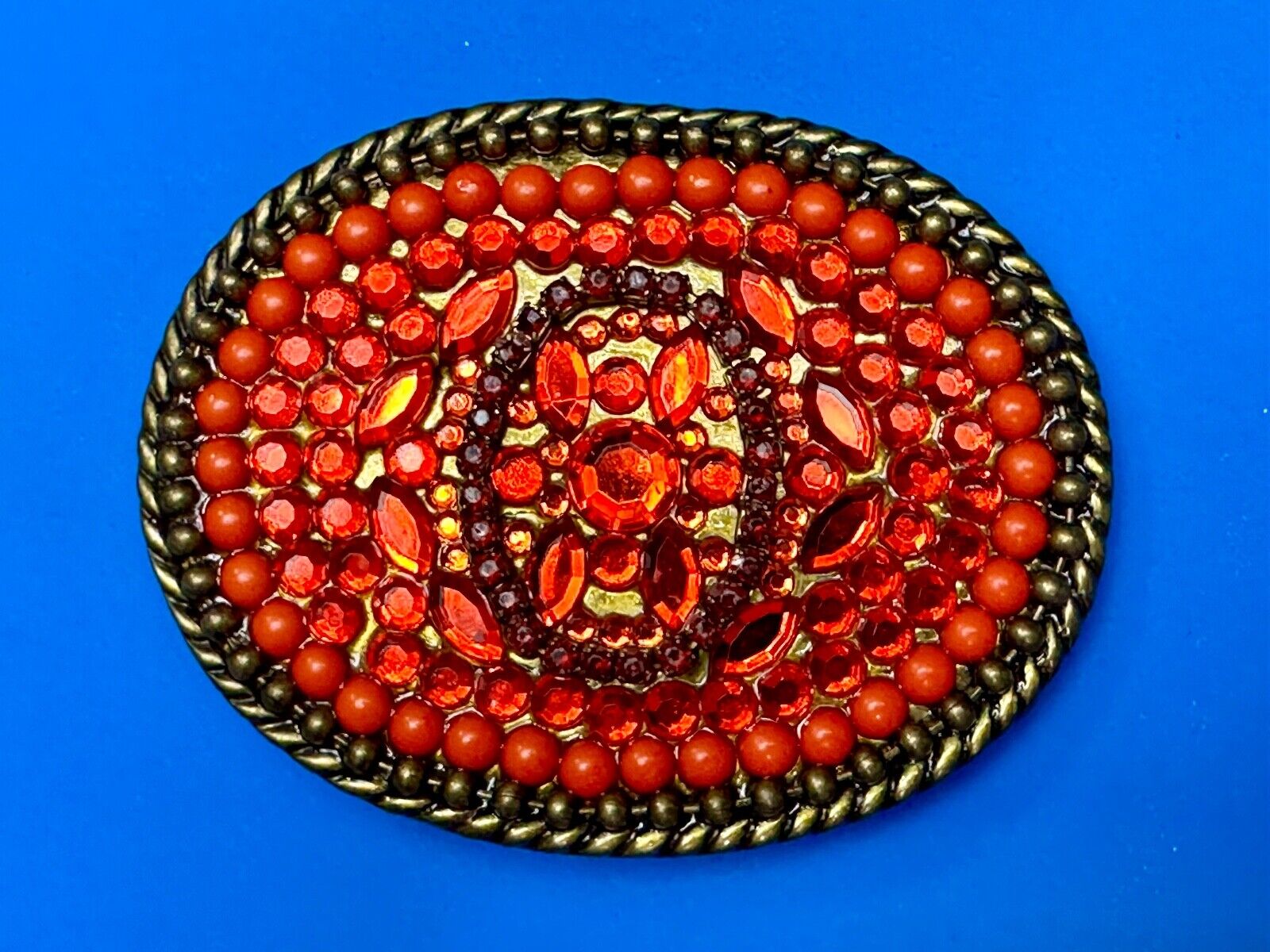 Unique Shades of Red - Mixed Materials oval outlined Belt Buckle