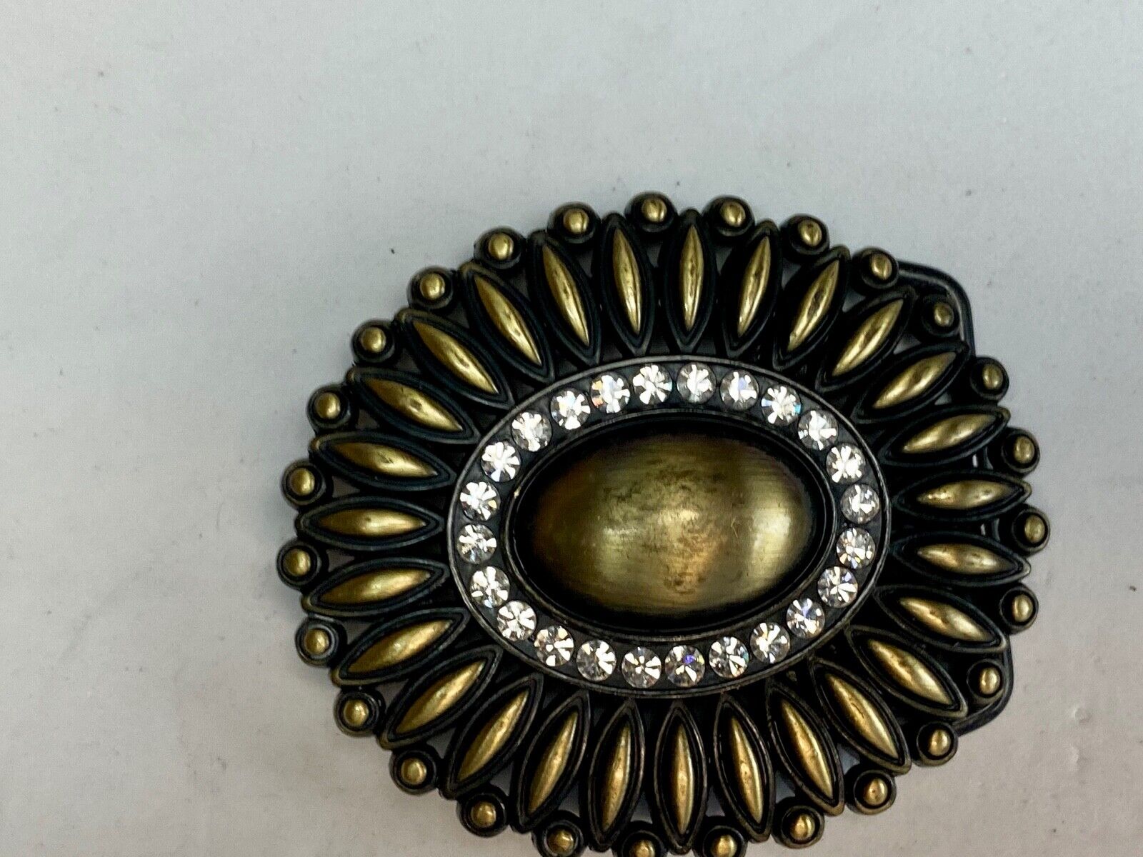 Beautiful southwest vibe layered belt buckle with ring of rhinestones 