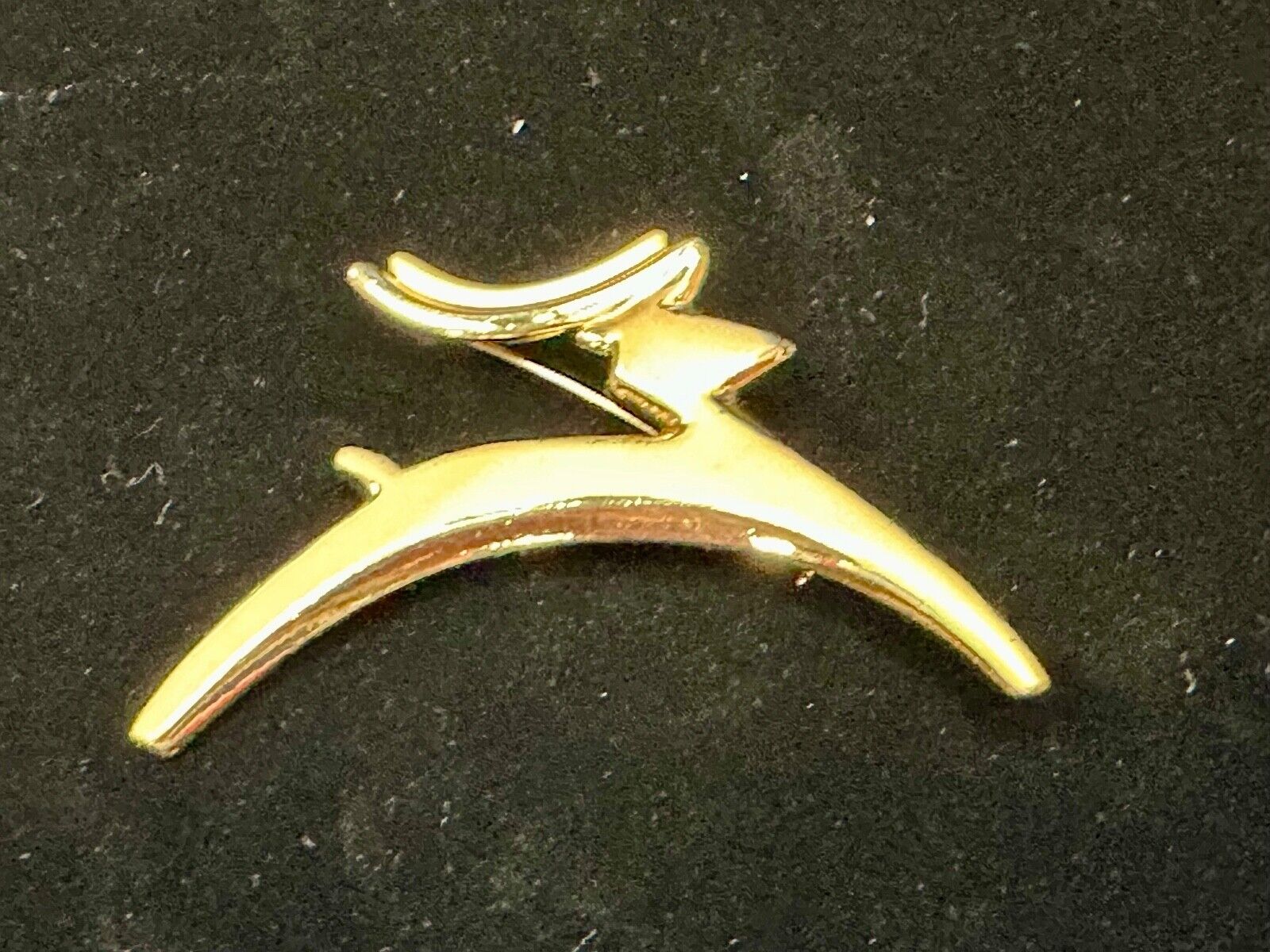 Abstract gold tone running deer - Vintage Christmas Holliday Brooch by AJC