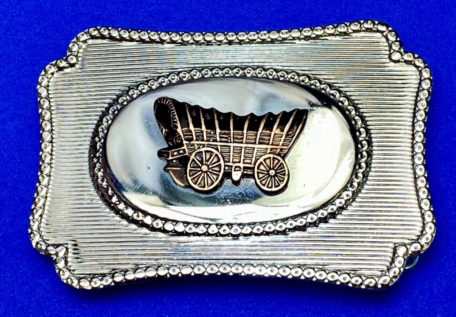 Vintage Covered wagon two tone reflective pre loved, western framed belt buckle