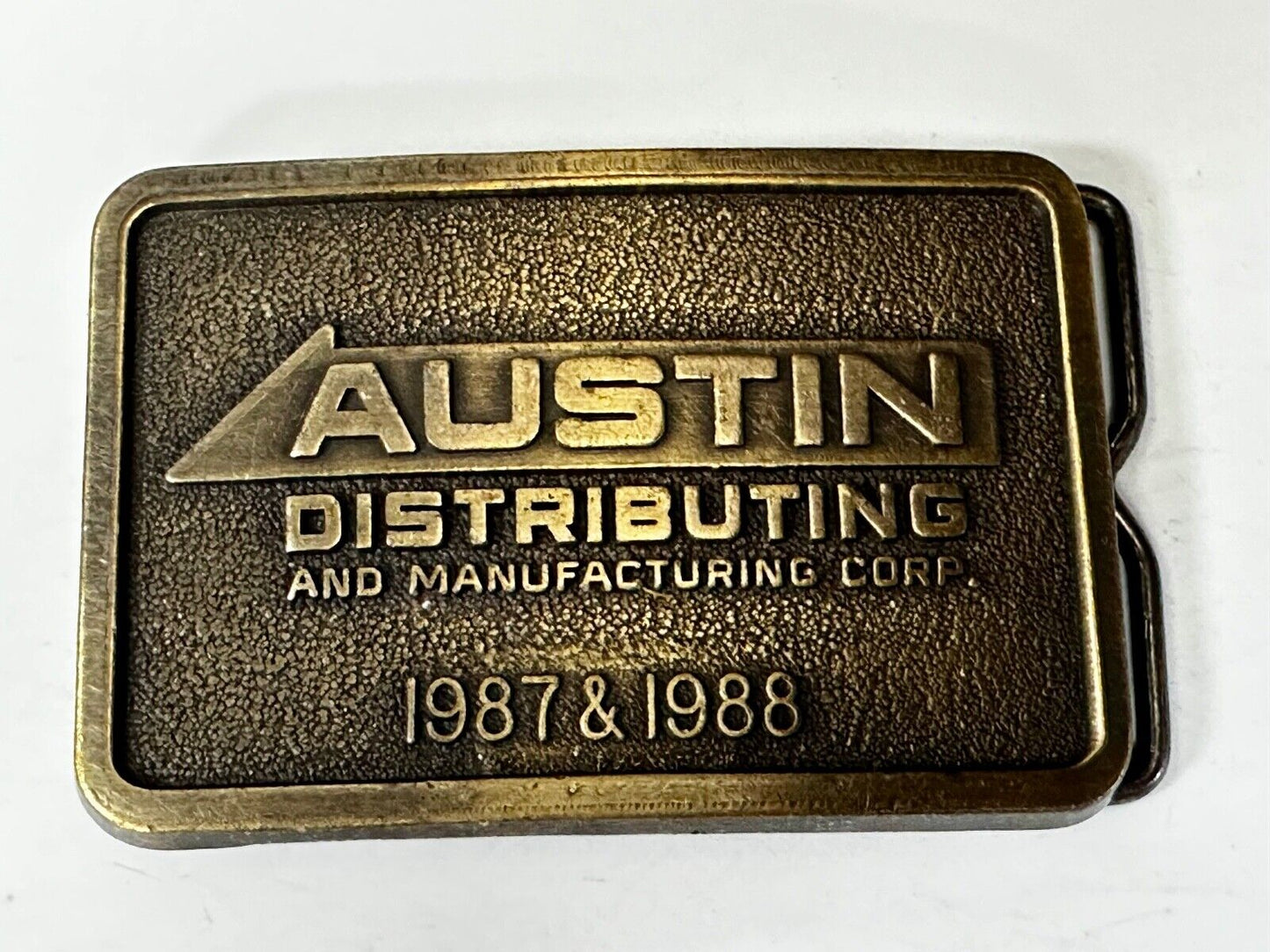 Austin Texas Distributing and Manufacturing 1987 Advertisement Promo Belt Buckle