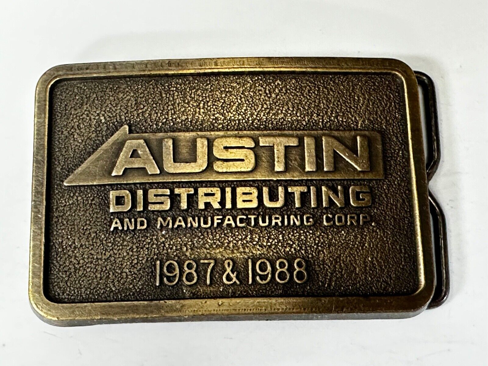 Austin Texas Distributing and Manufacturing 1987 Advertisement Promo Belt Buckle