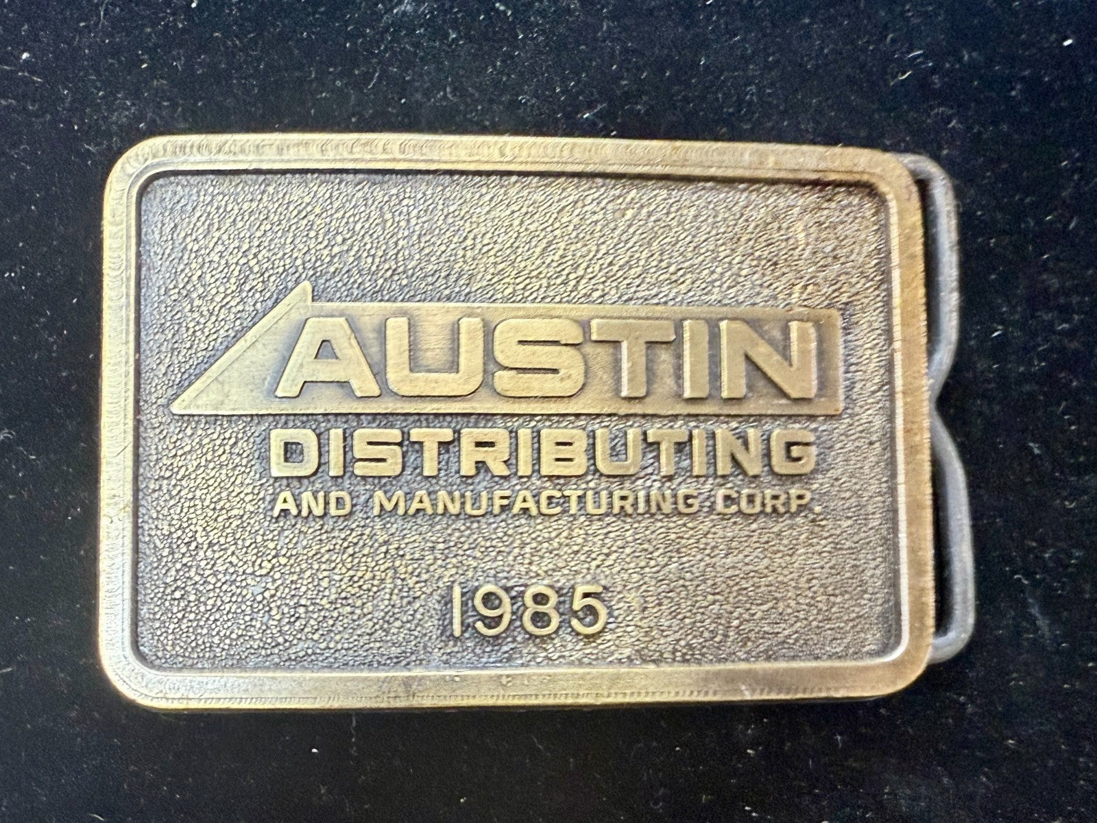 Austin Texas Distributing and Manufacturing Corp 1985 NOS RJ Belt Buckle