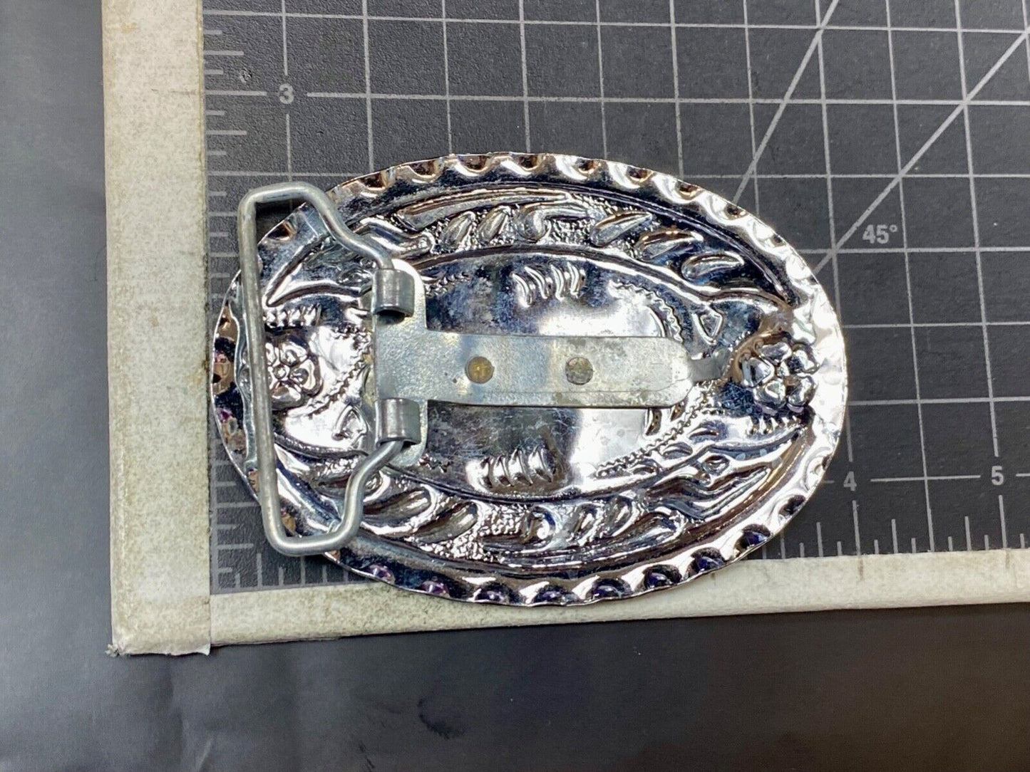 Vintage horse head through lucky horseshoe on mixed metal western belt buckle