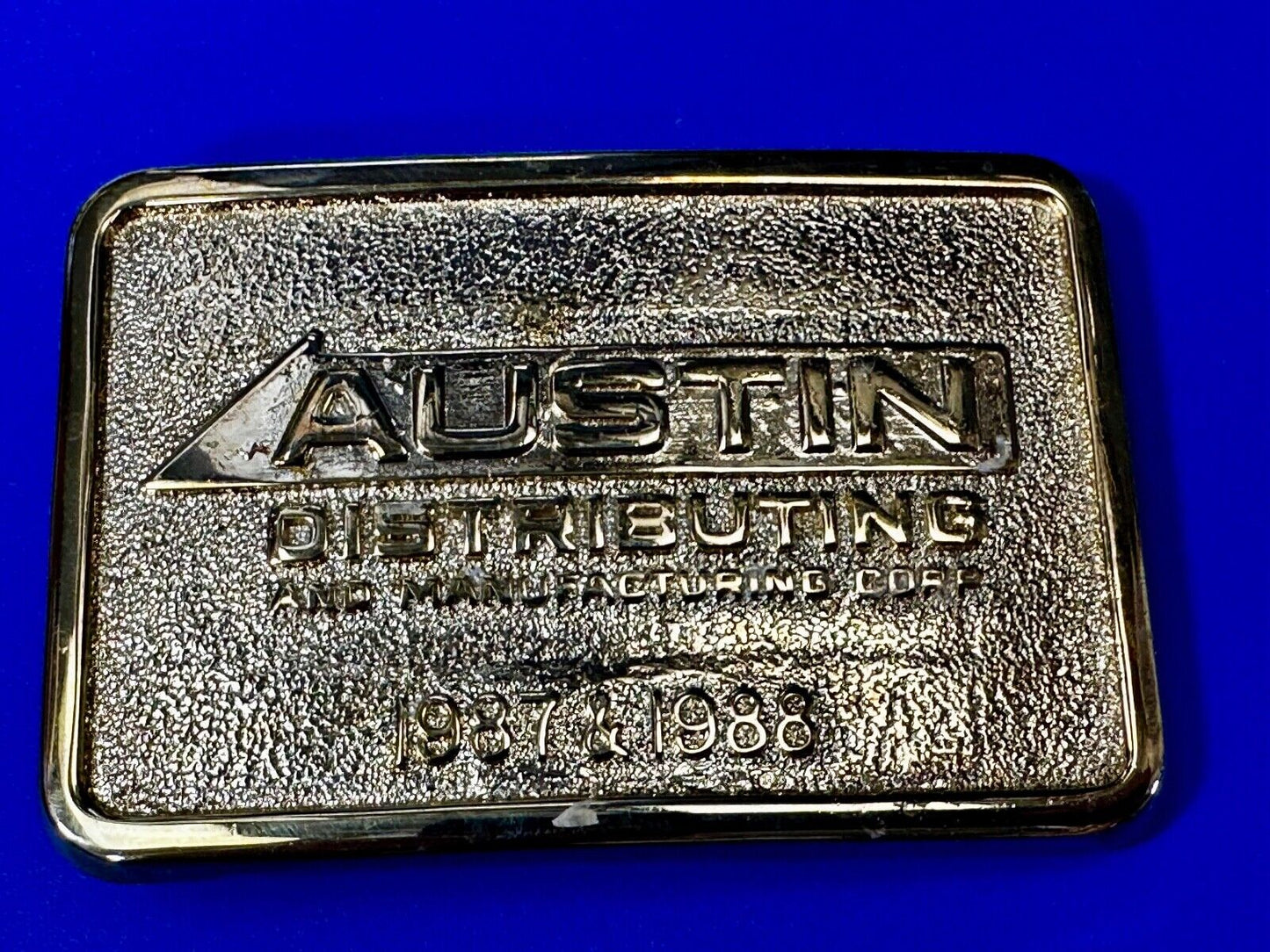 Austin Texas Distributing and Manufacturing 1987 Gold Tone Belt Buckle