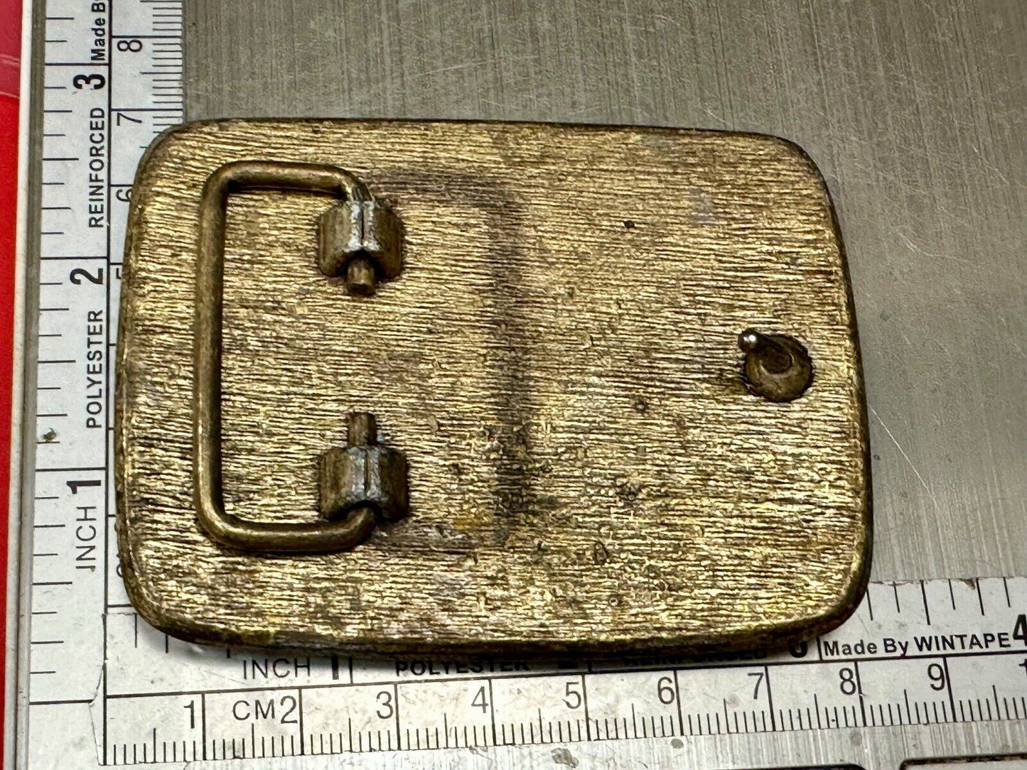 unique rhinestone accented swirl pattern on rounded rectangular belt buckle