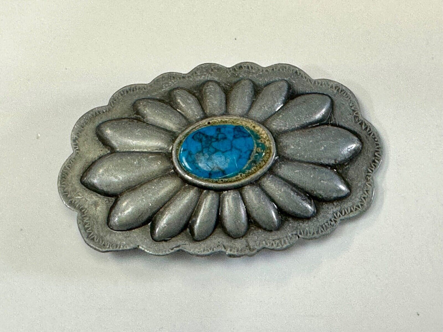 Turquoise stone centered on Vintage metal flower theme belt buckle