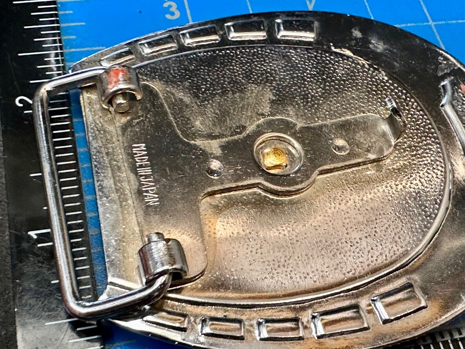 Artisan Resin covered Horseshoe shaped Belt Buckle with gold tone standing horse