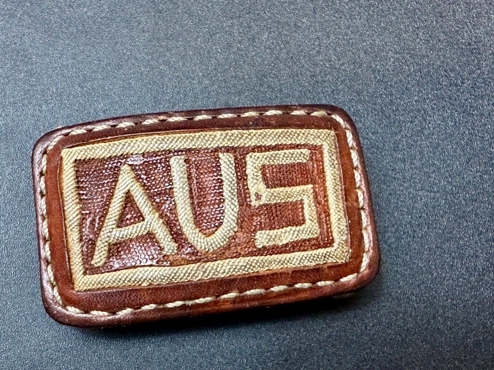 AUS  Brown leather with cream color Stitching  pre loved belt buckle