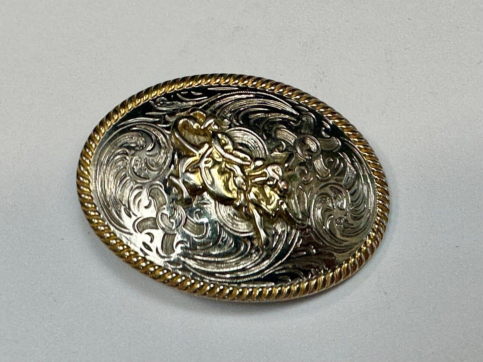 2.5" wide Two tone Vintage western rodeo cowboy belt buckle.
