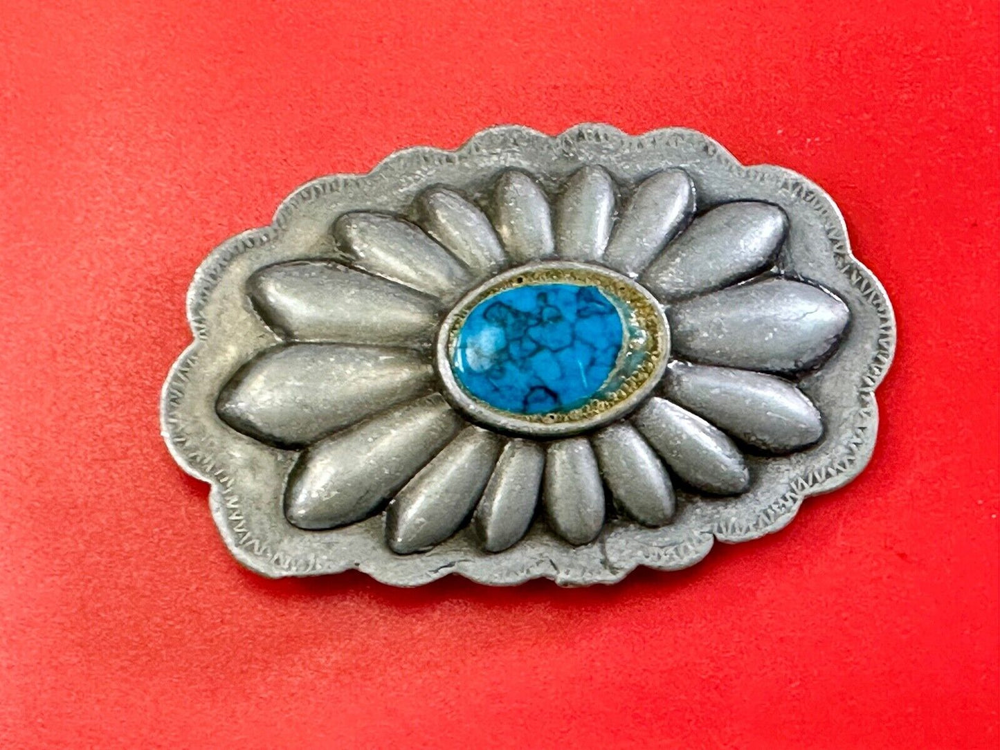 Turquoise stone centered on Vintage metal flower theme belt buckle