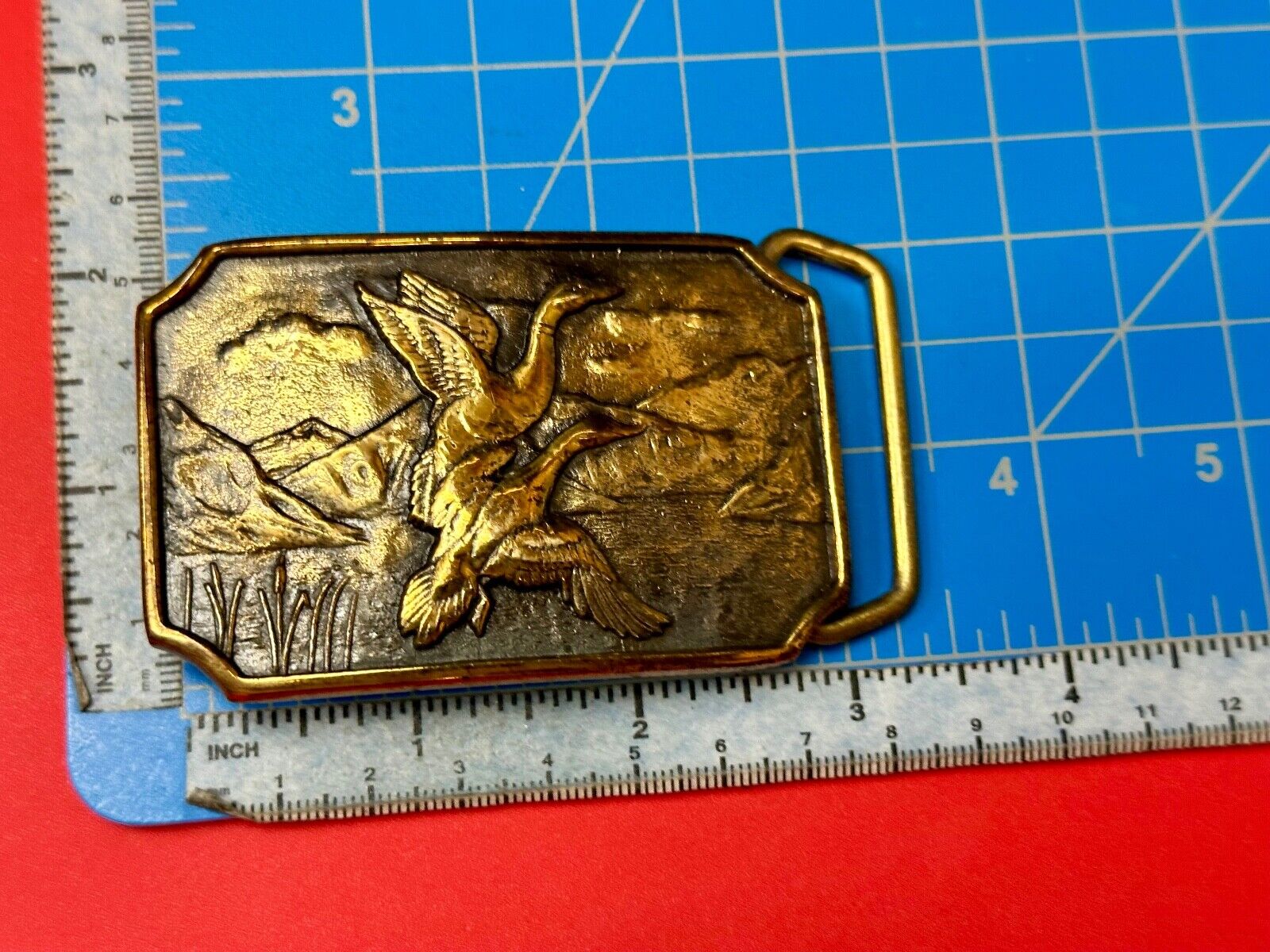 Two ducks flying from pond cat tails Nature Solid Brass belt buckle by BTS