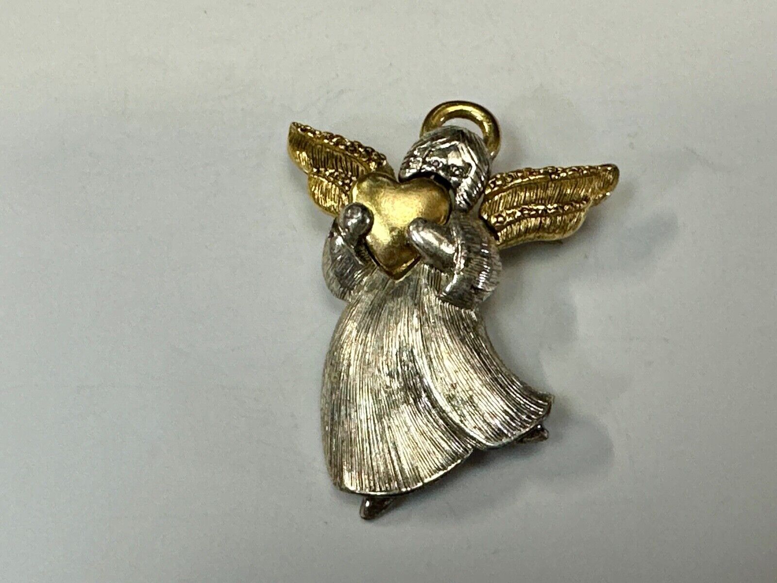 Angle holding heart -vintage two tone LC Liz Claiborne Signed Brooch Pin