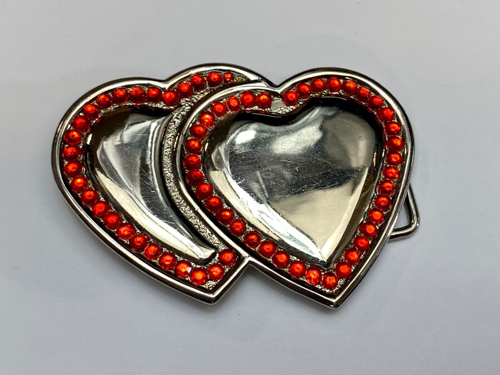 Two Jeweled Hearts Red Rhinestone outlining silver tone cutout belt buckle