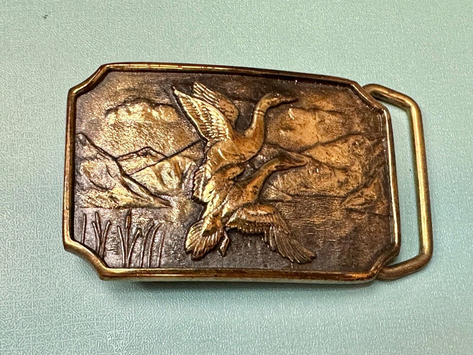 Two ducks flying from pond cat tails Nature Solid Brass belt buckle by BTS