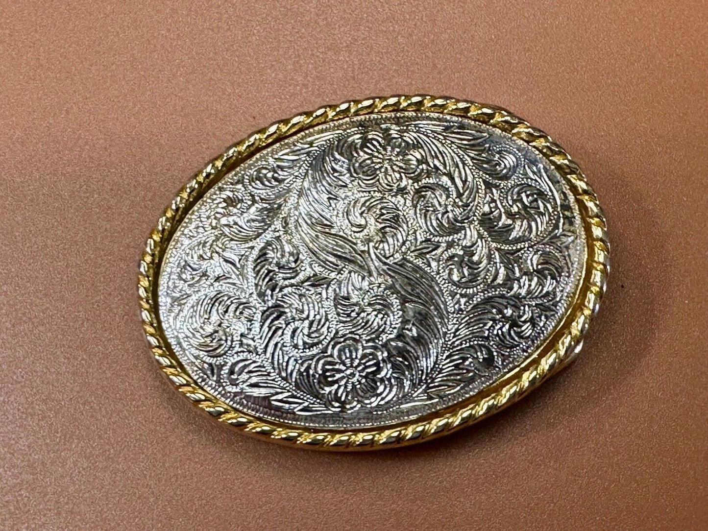 vintage Ivan Brand western flower swirl design two tone oval belt buckle