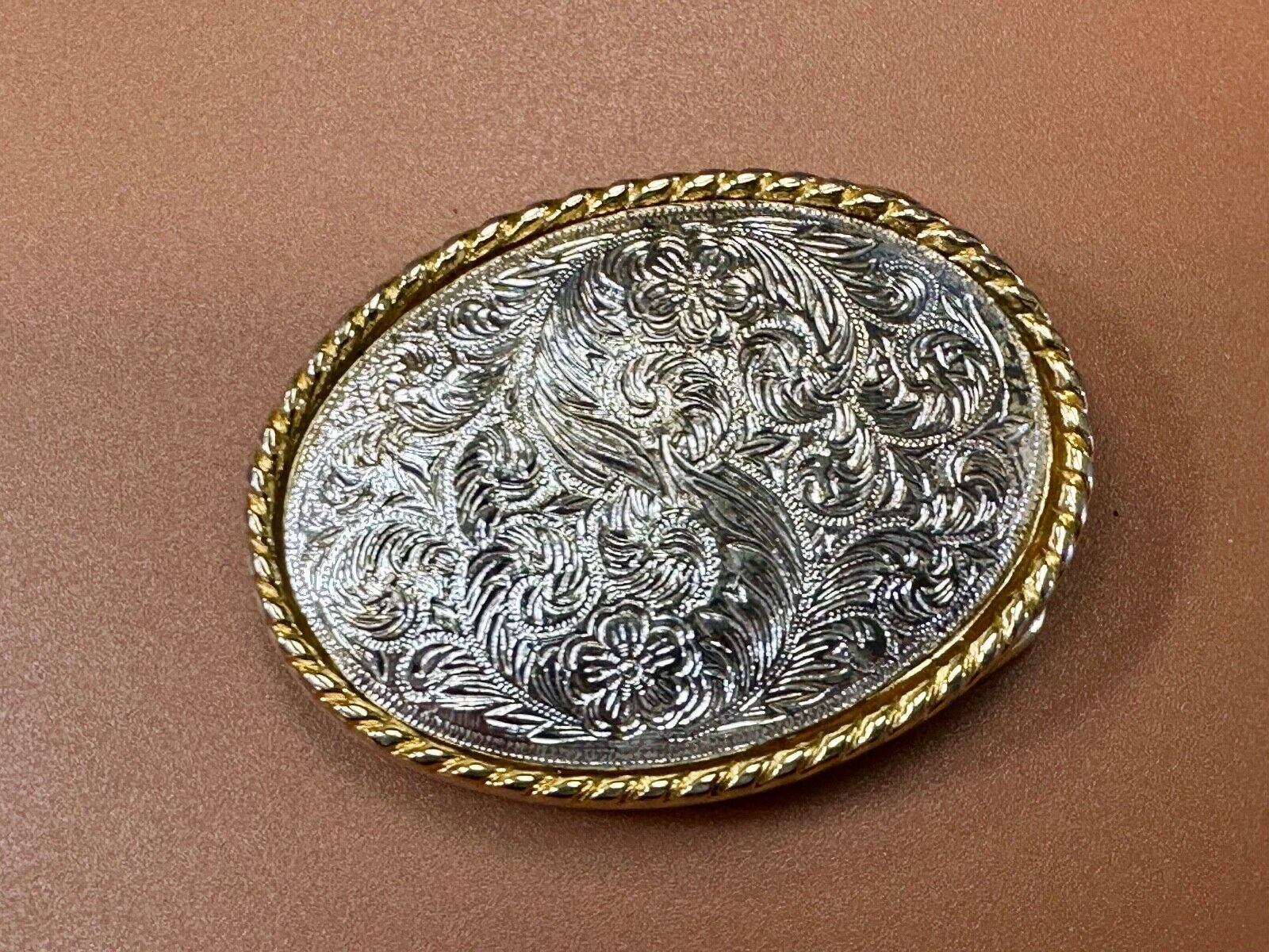 vintage Ivan Brand western flower swirl design two tone oval belt buckle