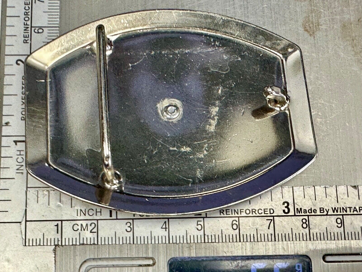 Vintage Horseback Riders cowboys belt buckle with black & white enamel accents