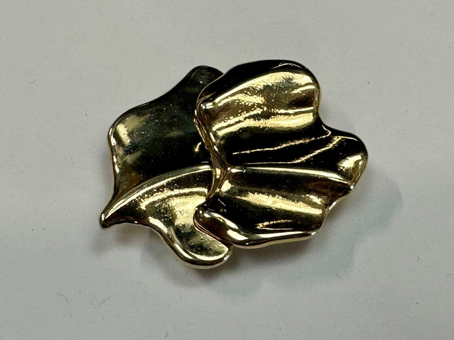Two-piece interlocking gold tone leaf swirl theme belt slide buckle signed _____