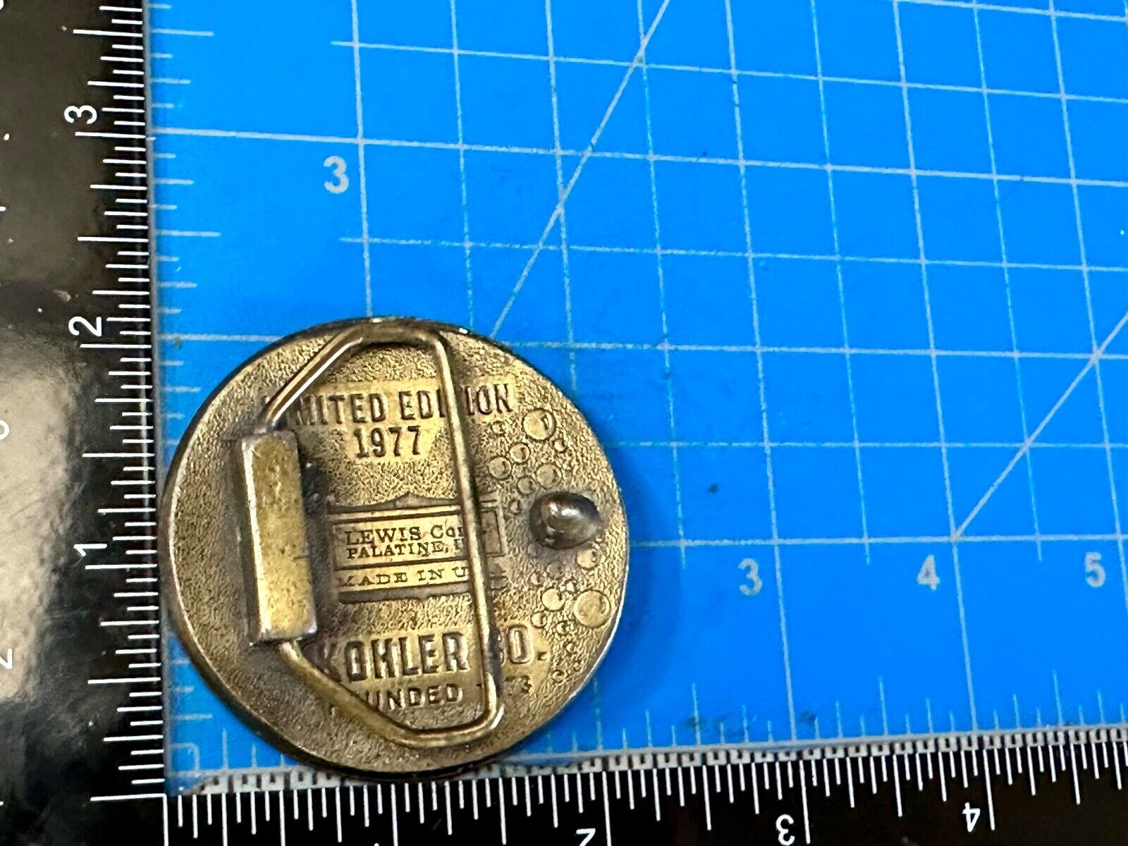 The Bold Look of Kohler Vintage 1977 Lewis round Limited Edition belt buckle