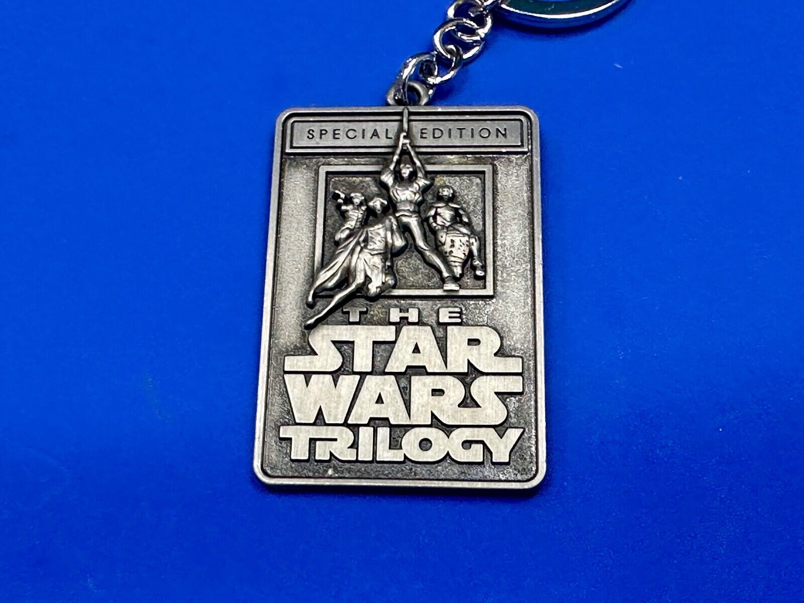 The Star Wars Trilogy Logo Emblem NOS Keychain!