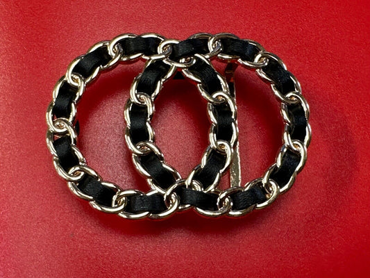 Two gold tone Overlapping Circle's with black ribbon through-out belt buckle