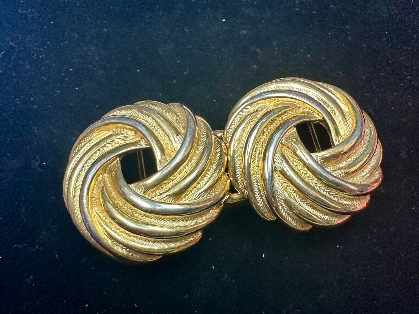 Two piece Round Swirl Interlocking gold color belt buckle by Douglas Paquette