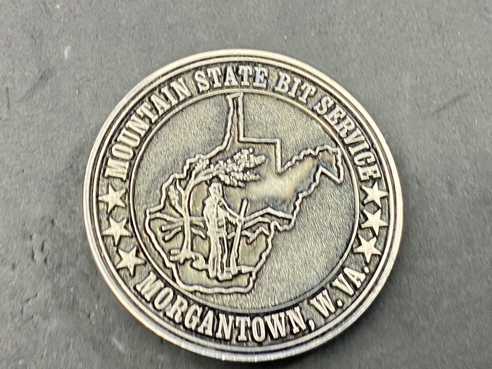 Vintage  Mountain State Bit Services Morgantown W.V. round belt buckle  by Lewis