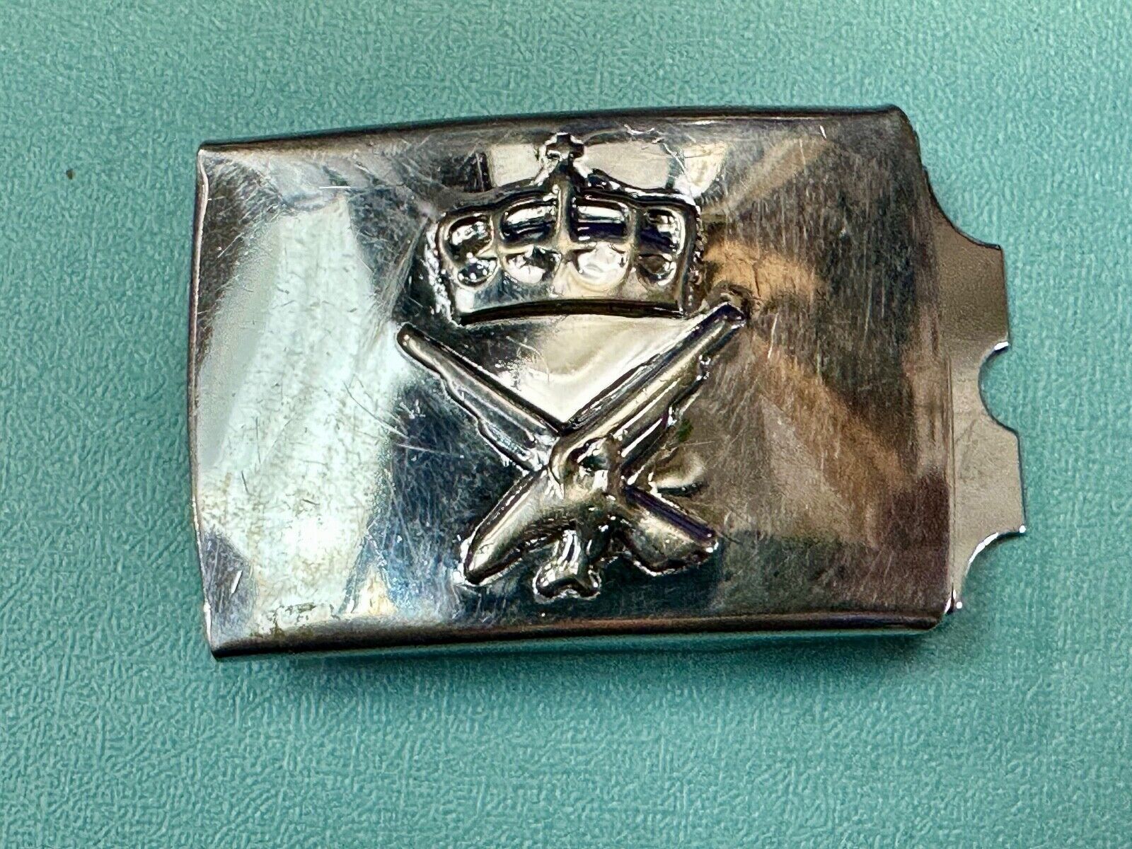 unknown to me!   dress style silver tone crown X crest? stamped belt buckle