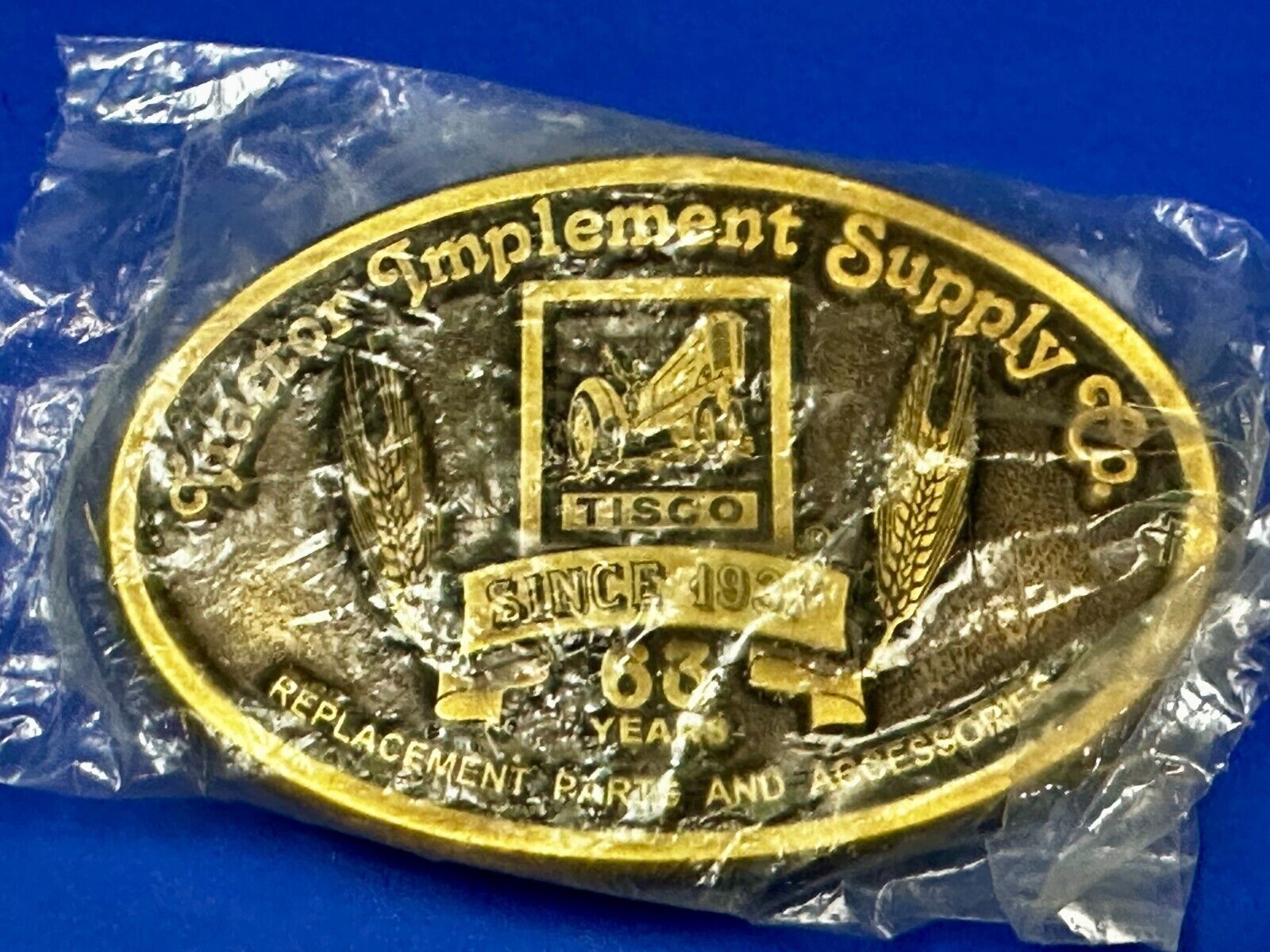 63 years TISCO Tractor Implement Supply company Vintage Belt Buckle by Speccast