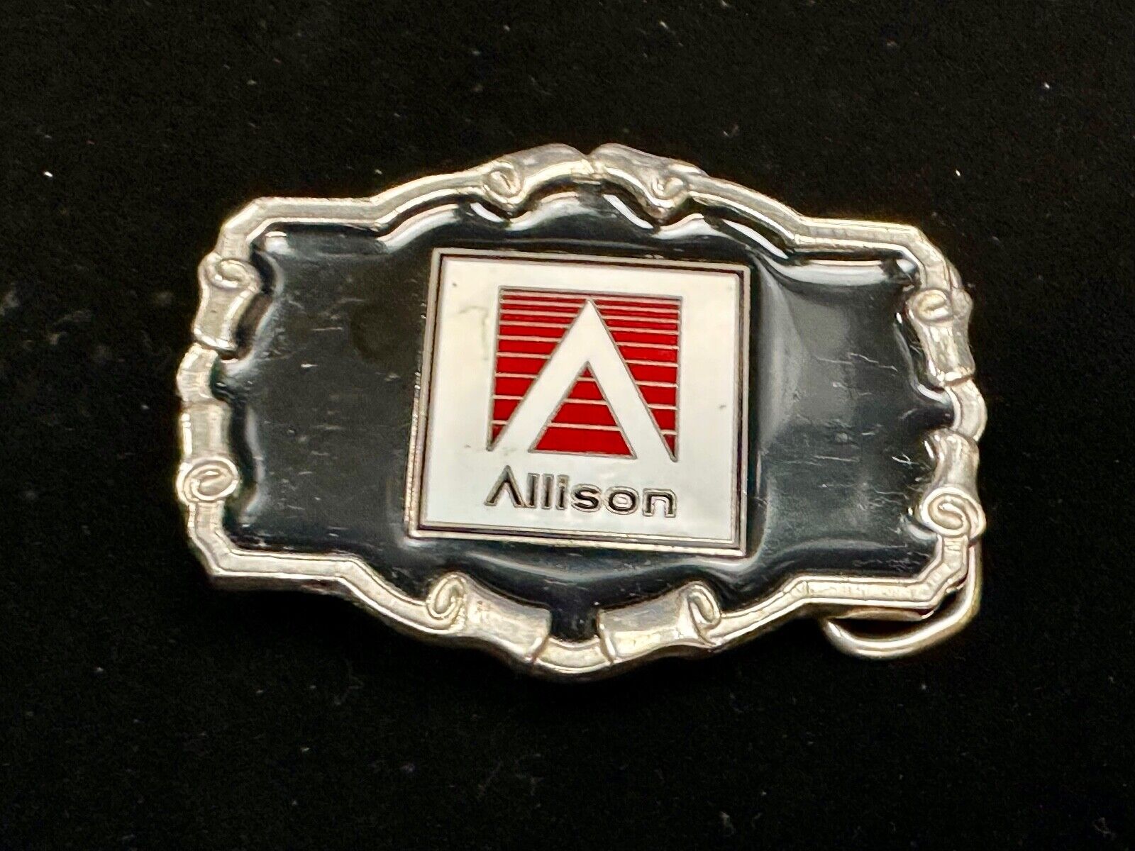 Allison Company logo emblem on western framed black enameled belt buckle