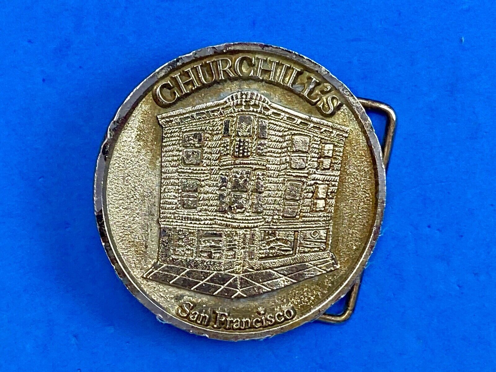 Vintage Churchill's San Francisco belt buckle by American pewter works the bar? 